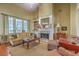 This spacious living room has large windows and a fireplace at 2005 Carriage Way, Summerville, SC 29485