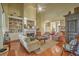 Spacious living room with hardwood floors, a fireplace, built-in bookshelves, and ample seating at 2005 Carriage Way, Summerville, SC 29485