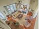 Open-concept living room featuring hardwood floors, a fireplace, and large windows with backyard views at 2005 Carriage Way, Summerville, SC 29485