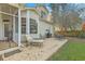 Back patio with seating, a barbecue grill, and access to the screened in porch and the backyard at 2005 Carriage Way, Summerville, SC 29485