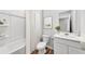 Bright bathroom featuring a bathtub-shower combo, single sink vanity, and sleek design at 207 West Bradford Pointe Dr, Summerville, SC 29486