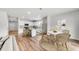 Bright, open-concept kitchen and dining area with modern appliances and stylish decor at 207 West Bradford Pointe Dr, Summerville, SC 29486