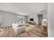 Cozy living room with neutral colors, wood floors, and plenty of natural light at 207 West Bradford Pointe Dr, Summerville, SC 29486