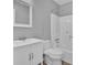 Bathroom features a tub/shower combo with white tile surround, vanity, toilet, and a mirror at 208 Greencastle Dr, Goose Creek, SC 29445
