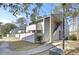 Charming multi-level condo complex with white siding and natural surroundings at 208 Greencastle Dr, Goose Creek, SC 29445