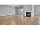 Inviting living room with a fireplace and sliding doors to the balcony, flooded with natural light at 208 Greencastle Dr, Goose Creek, SC 29445