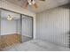 Enclosed patio features plank walls, a ceiling fan, and sliding glass doors to living room at 208 Greencastle Dr, Goose Creek, SC 29445