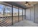 Screened in patio with lattice trim, concrete floor, and access door at 208 Greencastle Dr, Goose Creek, SC 29445