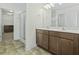 Bathroom featuring double sinks, a walk-in shower and a walk-in closet at 213 Crossandra Ave, Summerville, SC 29483
