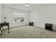 Bedroom with neutral walls and carpeting and a large window at 213 Crossandra Ave, Summerville, SC 29483