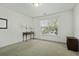 Bedroom with neutral walls and carpeting and a large window at 213 Crossandra Ave, Summerville, SC 29483