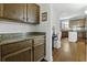 Butler pantry with ample storage, granite countertop, and access to the kitchen at 213 Crossandra Ave, Summerville, SC 29483
