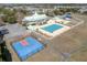 A comprehensive view of community amenities, featuring a pool, basketball court, and clubhouse in a single frame at 213 Crossandra Ave, Summerville, SC 29483