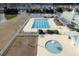 A broad view of the community pool with various recreational areas, including a splash zone and playground at 213 Crossandra Ave, Summerville, SC 29483