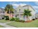 Charming two-story home with a well-manicured front lawn at 213 Crossandra Ave, Summerville, SC 29483