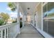 Inviting covered front porch with white railing, a relaxing outdoor space at 213 Crossandra Ave, Summerville, SC 29483
