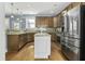 Modern kitchen with stainless steel appliances, granite countertops, and a stylish center island at 213 Crossandra Ave, Summerville, SC 29483
