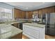 Well-equipped kitchen featuring granite countertops, stainless steel appliances, and a center island at 213 Crossandra Ave, Summerville, SC 29483