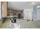 Spacious kitchen with granite countertops, stainless steel appliances, and a convenient layout for easy meal preparation and entertaining at 213 Crossandra Ave, Summerville, SC 29483
