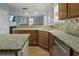 Kitchen with granite countertops, stainless steel appliances, and a seamless transition into the living room, perfect for entertaining at 213 Crossandra Ave, Summerville, SC 29483