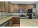 Well-equipped kitchen featuring granite countertops, a stainless steel gas range, and stainless steel appliances at 213 Crossandra Ave, Summerville, SC 29483