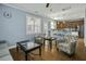 Open-concept layout seamlessly connects the living room to the kitchen, creating a perfect space for entertaining and socializing at 213 Crossandra Ave, Summerville, SC 29483