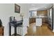 Office nook adjacent to the kitchen with a small desk, chair, and task lighting at 213 Crossandra Ave, Summerville, SC 29483