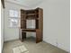 Small home office with a built-in desk and shelf provides a focused workspace at 213 Crossandra Ave, Summerville, SC 29483