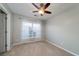 Bright bedroom featuring a ceiling fan, neutral paint, carpet flooring, and large window at 240 Island Green Rd, Goose Creek, SC 29445