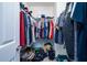 Walk-in closet crammed with clothing and storage items, showcasing ample storage capacity at 240 Island Green Rd, Goose Creek, SC 29445