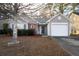 Charming one-story home featuring a single-car garage, well-maintained landscaping, and inviting curb appeal at 240 Island Green Rd, Goose Creek, SC 29445
