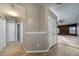 Hallway featuring neutral paint, tile and carpet flooring, with access to multiple rooms at 240 Island Green Rd, Goose Creek, SC 29445