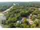 Expansive aerial perspective of a beautiful community, with a home nestled among lush trees and a golf course nearby at 2455 The Haul Over, Seabrook Island, SC 29455