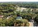 Beautiful aerial shot showcasing the home's serene setting surrounded by trees, a pond, and a nearby golf course at 2455 The Haul Over, Seabrook Island, SC 29455