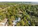 Overhead shot of a home in a forested area near a river, with a blend of natural beauty and residential charm at 2455 The Haul Over, Seabrook Island, SC 29455
