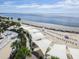 Relaxing beach view of the ocean with lounge chairs under white cabanas at 2455 The Haul Over, Seabrook Island, SC 29455