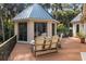 Exterior gazebo with seating and table, surrounded by palm trees, for relaxing outdoors at 2455 The Haul Over, Seabrook Island, SC 29455