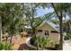 Lush landscaping surrounds this beautiful home. The unique roof and mature trees give this home great curb appeal at 2455 The Haul Over, Seabrook Island, SC 29455