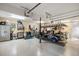 Spacious garage interior with a workbench, storage cabinets, and a golf cart at 2455 The Haul Over, Seabrook Island, SC 29455