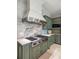 Up-close shot of the kitchen highlighting the gourmet gas range and a stainless steel vent hood at 2455 The Haul Over, Seabrook Island, SC 29455