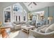 Inviting living room with soaring ceilings, a ceiling fan, and generous natural light at 2455 The Haul Over, Seabrook Island, SC 29455