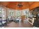This screened-in outdoor area has beautiful wood-paneled ceilings and a grill, perfect for summer gatherings at 2455 The Haul Over, Seabrook Island, SC 29455