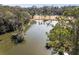Scenic view of a tranquil pond surrounded by lush trees, enhancing the natural beauty of the property at 2455 The Haul Over, Seabrook Island, SC 29455