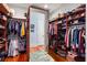Spacious walk-in closet featuring custom shelving, hanging racks, and wooden floors for organized storage at 2455 The Haul Over, Seabrook Island, SC 29455