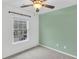 This bedroom features a ceiling fan, natural light from the window, and an accent wall at 250 Xavier St, Charleston, SC 29414