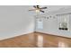 Bright and airy bedroom with hardwood floors, two windows, and minimalist decor at 250 Xavier St, Charleston, SC 29414