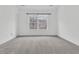 This bedroom features natural light from the window and neutral colored carpet at 250 Xavier St, Charleston, SC 29414