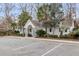 A community building featuring well-maintained landscaping, and ample parking for residents at 250 Xavier St, Charleston, SC 29414
