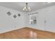 Bright dining area features hardwood floors, a large window, and a stylish chandelier at 250 Xavier St, Charleston, SC 29414