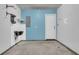 The garage features painted walls, a utility sink, and peg board for organization at 250 Xavier St, Charleston, SC 29414